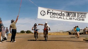 Leon Fisher and Phil McDonald breast the finish line in Birdsville